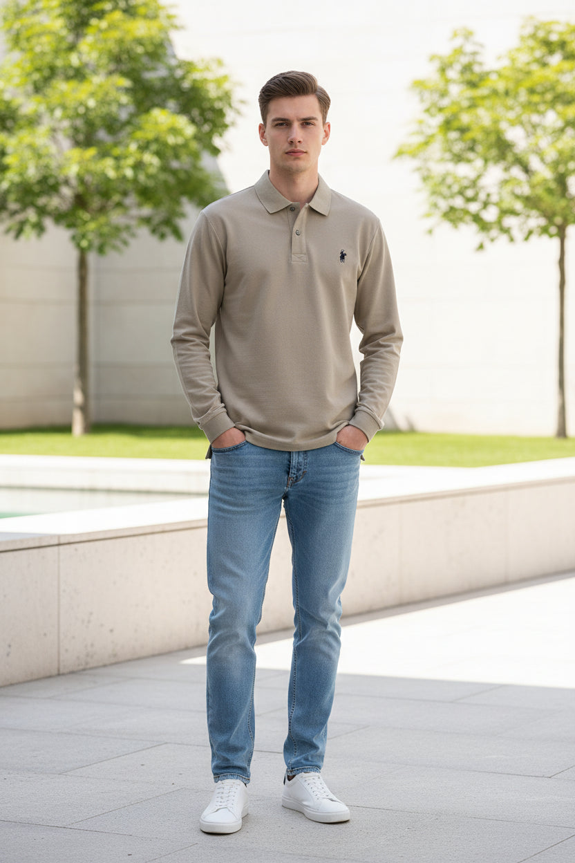 Beige polo shirt with Ralph Lauren logo held by a hand against a blurred background